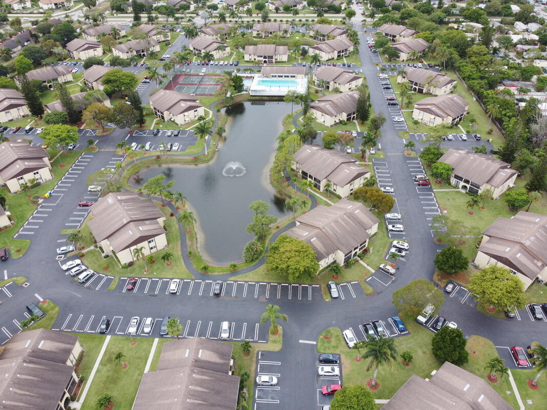 320 Pine Ridge Circle, Unit A1 Greenacres, FL 33463 - Photo 45 of 65 an aerial view of residential houses with outdoor space