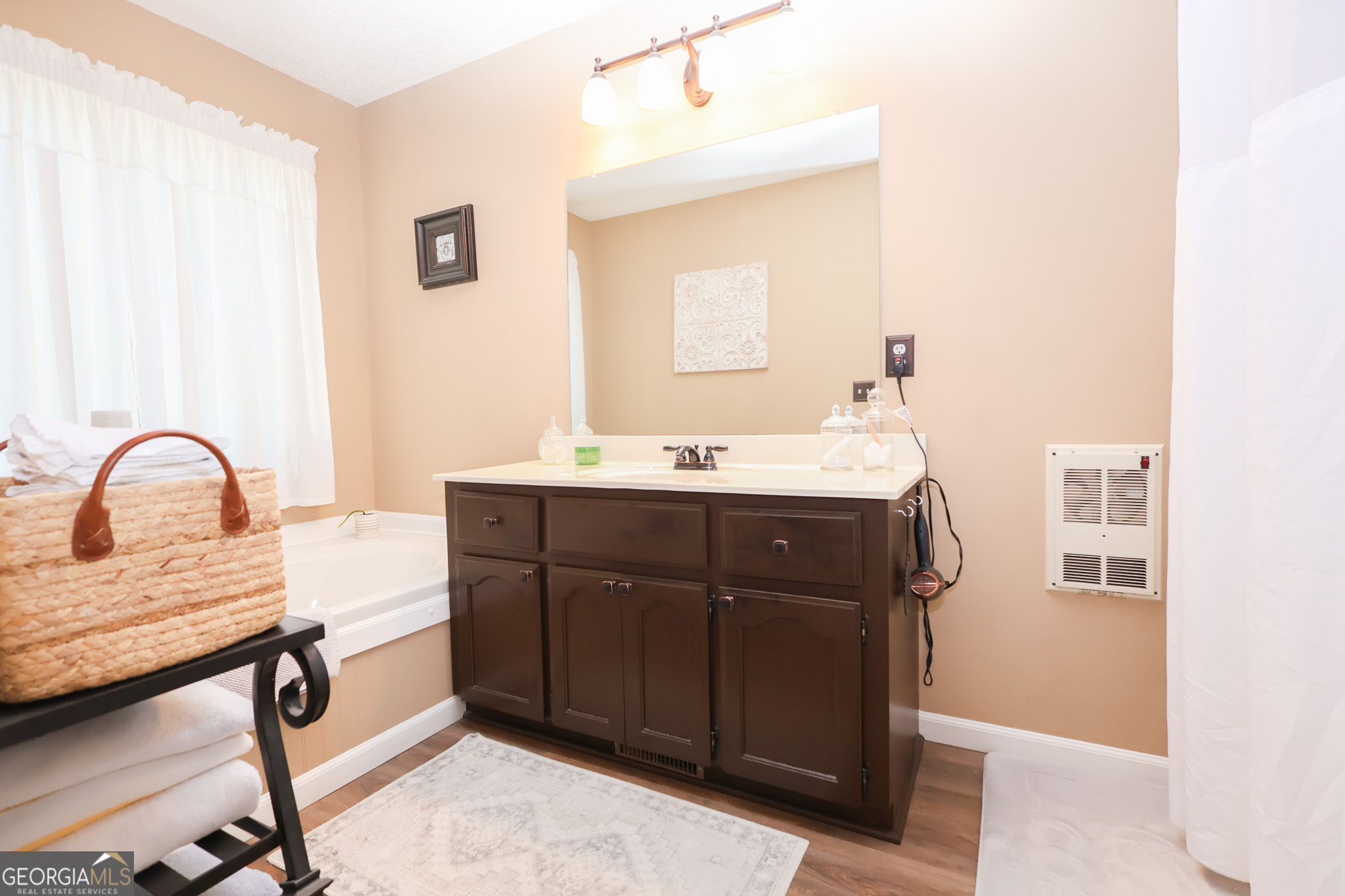 215 Stonefield Circle Macon, GA 31216 - Photo 13 of 26 a spacious bathroom with a sink and a mirror