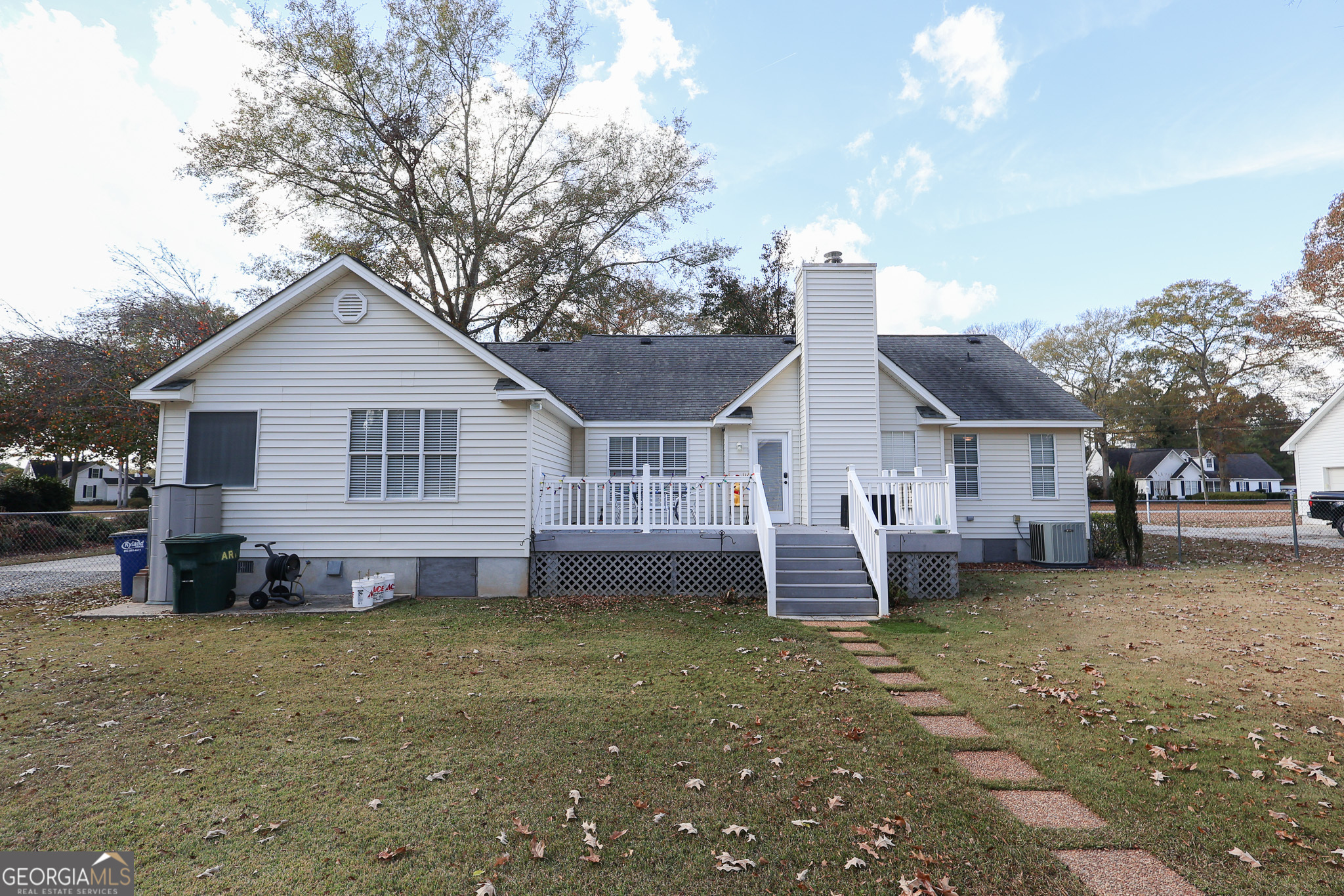 215 Stonefield Circle Macon, GA 31216 - Photo 18 of 26 a front view of a house with a yard and garage