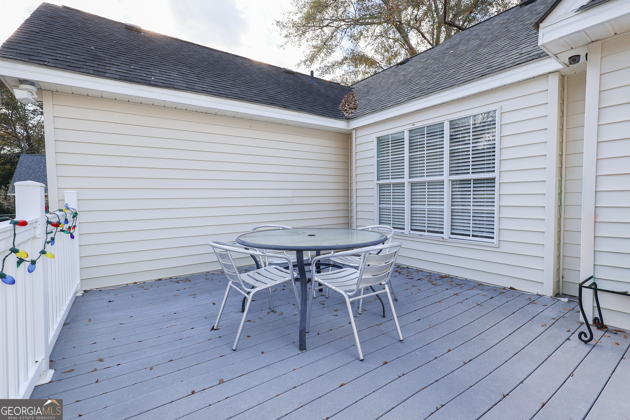 215 Stonefield Circle Macon, GA 31216 - Photo 19 of 26 a roof deck with a table and chairs and wooden floor