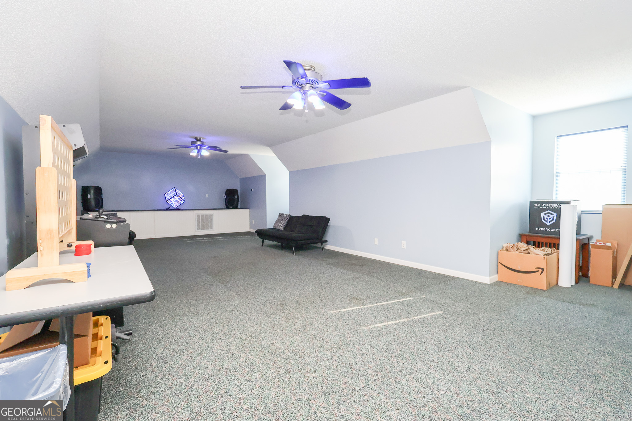 215 Stonefield Circle Macon, GA 31216 - Photo 25 of 26 a room with furniture and a chandelier