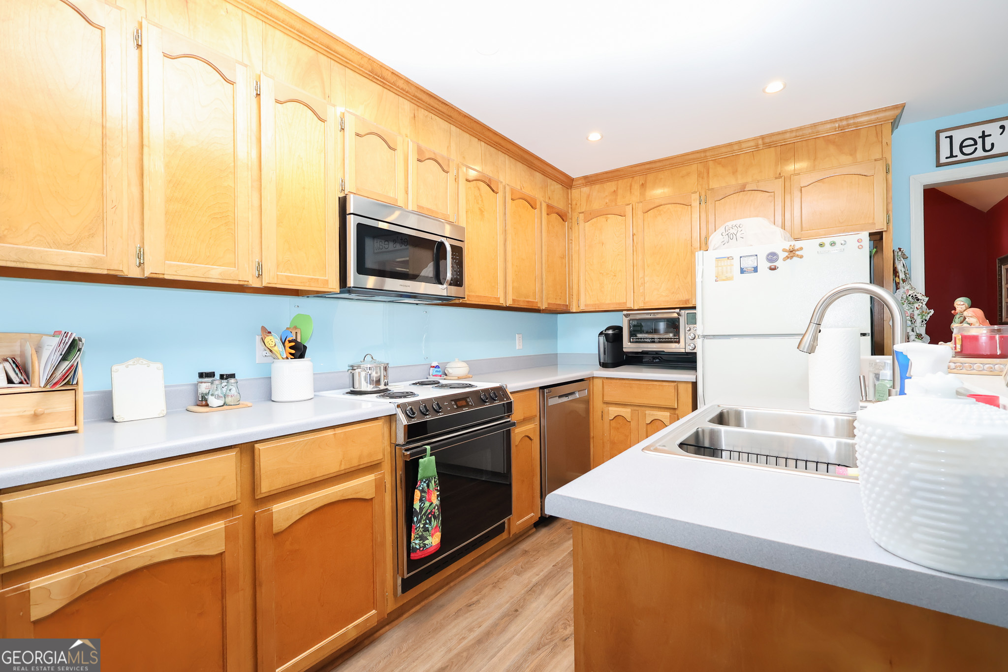 215 Stonefield Circle Macon, GA 31216 - Photo 8 of 26 a kitchen with stainless steel appliances granite countertop a sink and cabinets