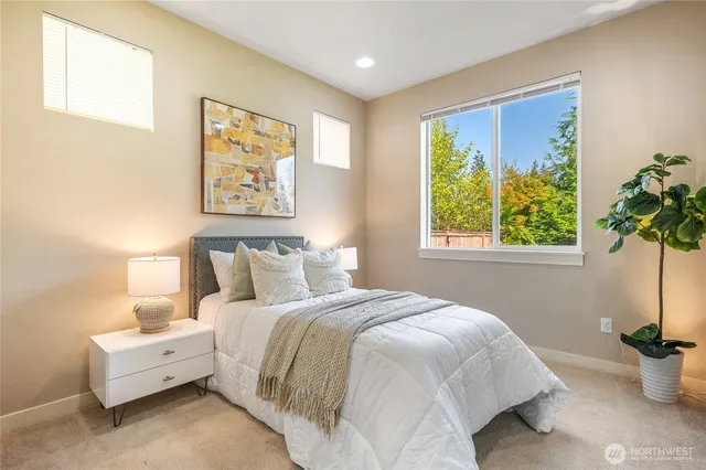 a bedroom with bed and a window