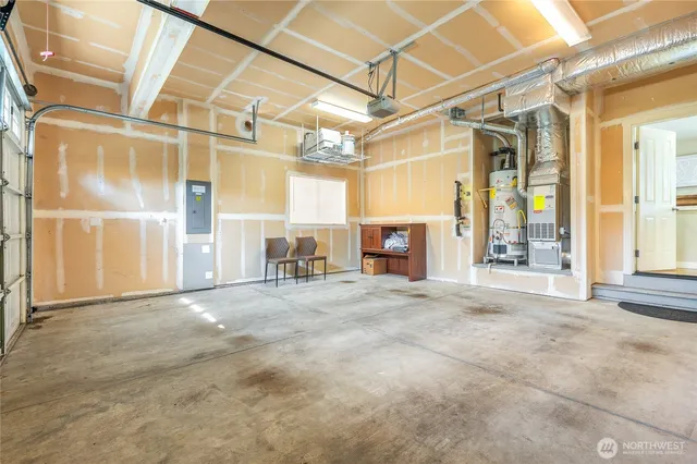 a view of a room with wooden floor and windows