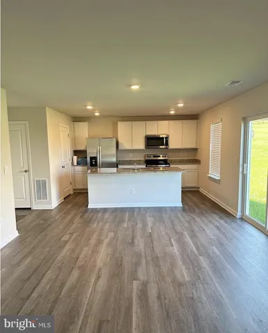 a view of kitchen with wooden floor