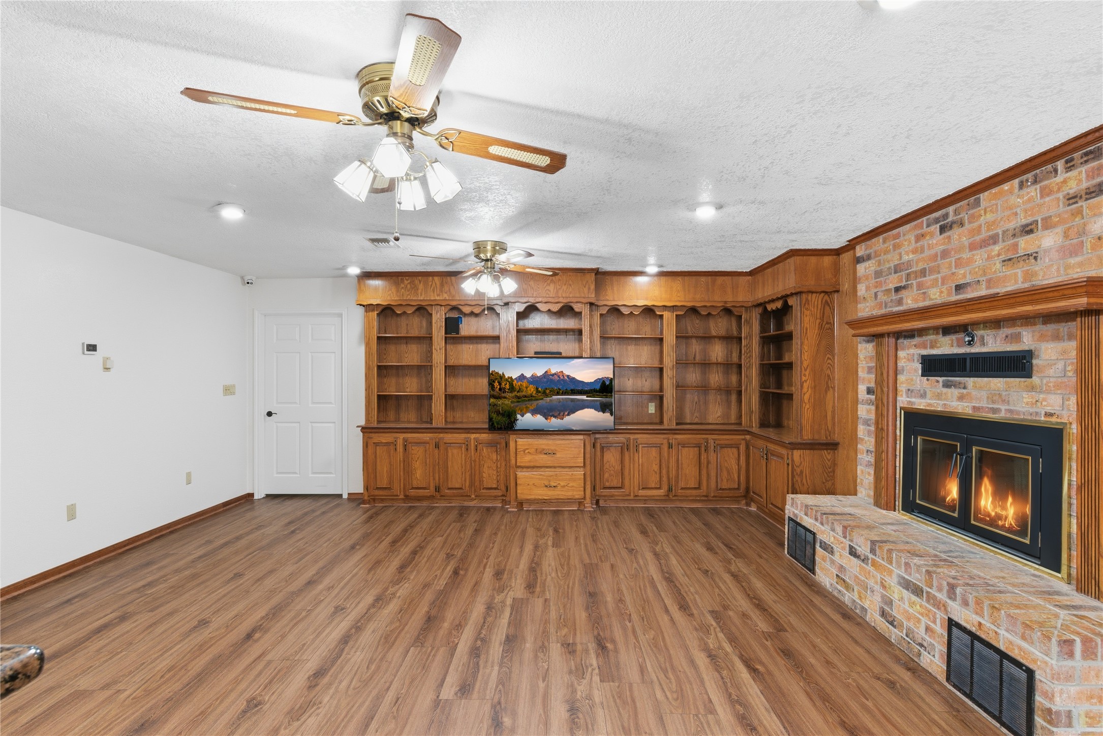436 County Road 502A Sweeny, TX 77480 - Photo 11 of 45 a kitchen with stainless steel appliances wooden floor and chandelier