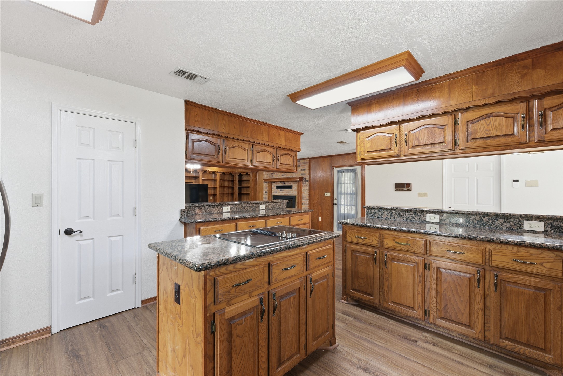 436 County Road 502A Sweeny, TX 77480 - Photo 17 of 45 a kitchen with granite countertop a sink and cabinets