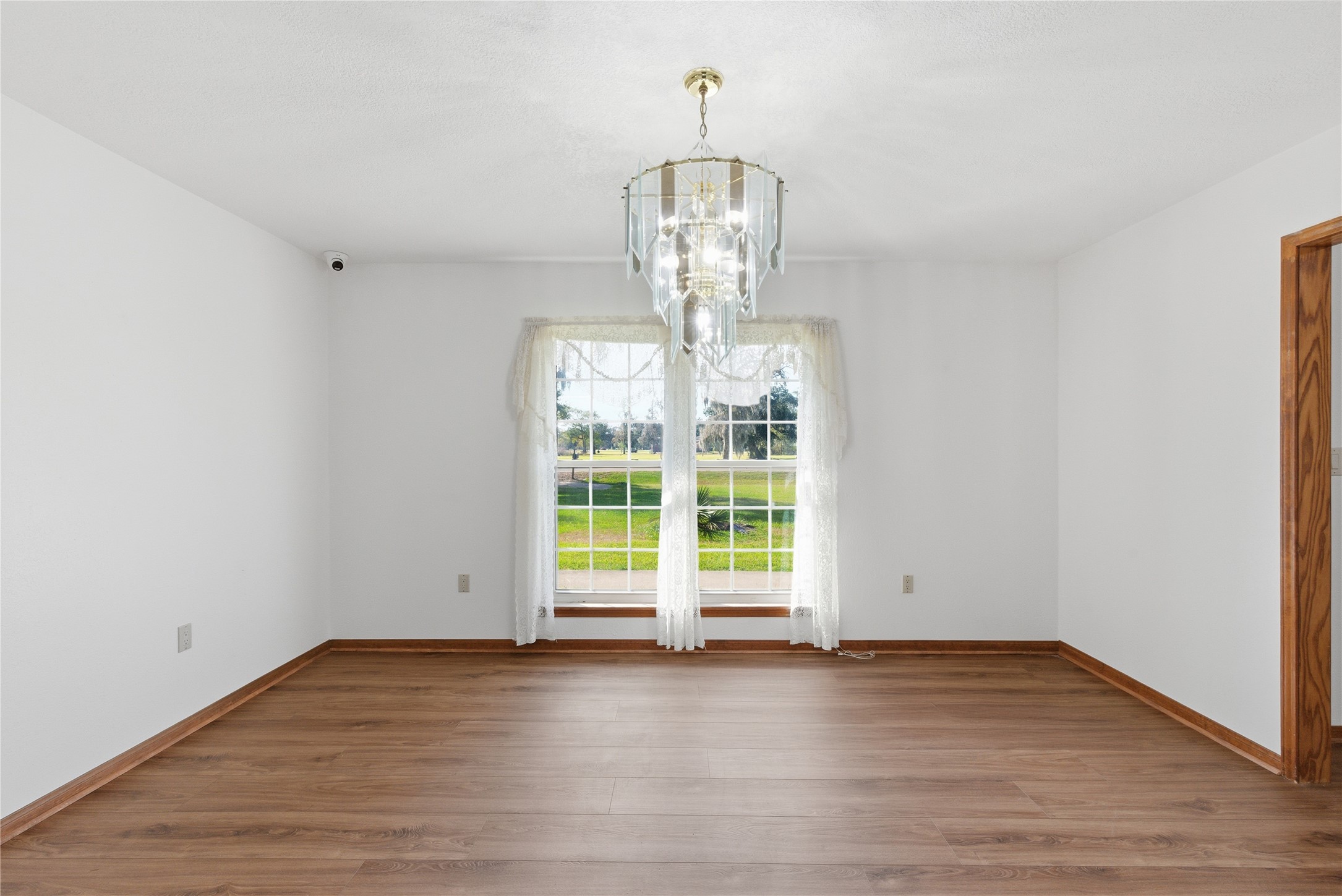 436 County Road 502A Sweeny, TX 77480 - Photo 19 of 45 an empty room with wooden floor and windows