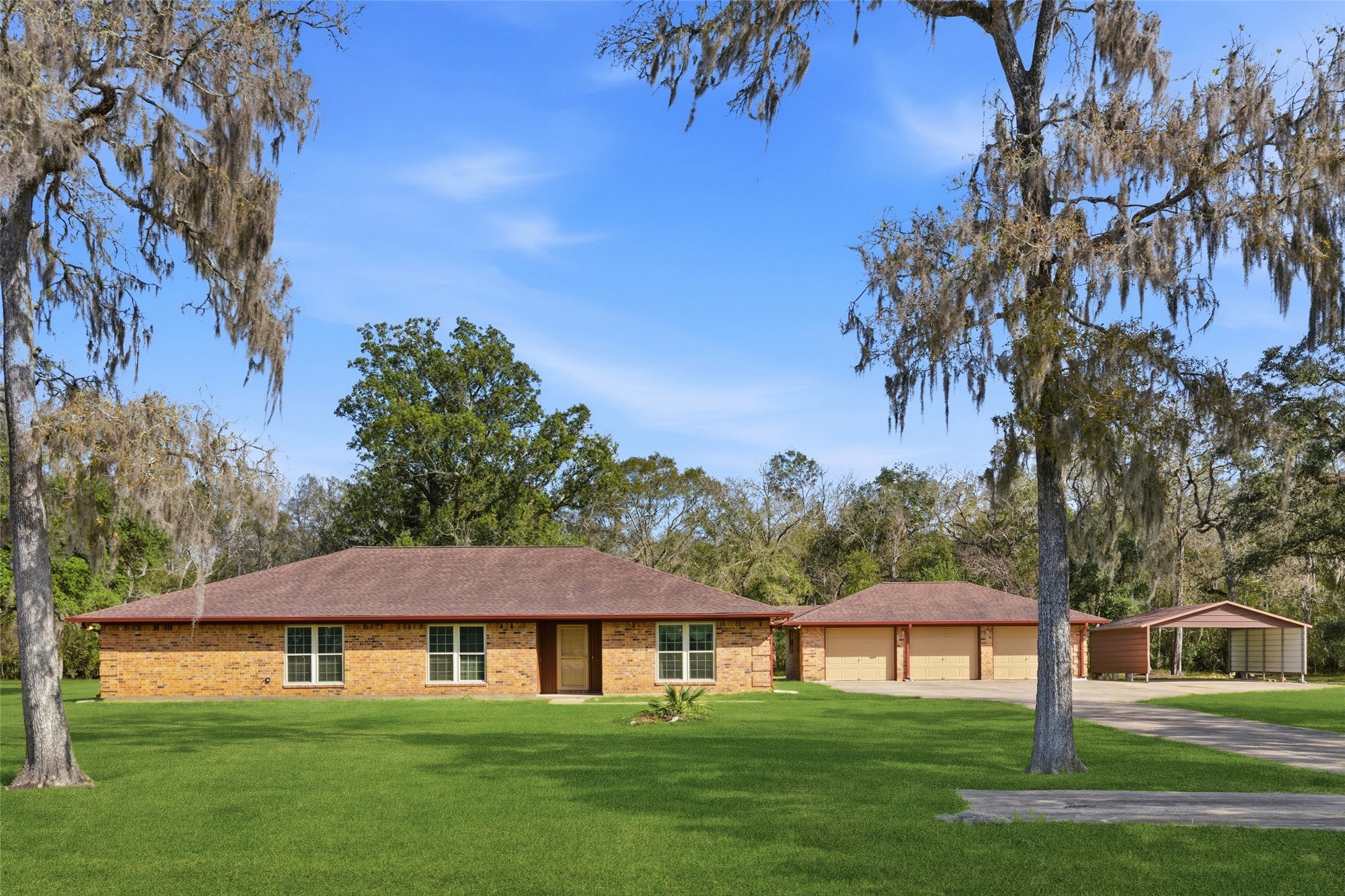 436 County Road 502A Sweeny, TX 77480 - Photo 2 of 45 a front view of a house with a garden