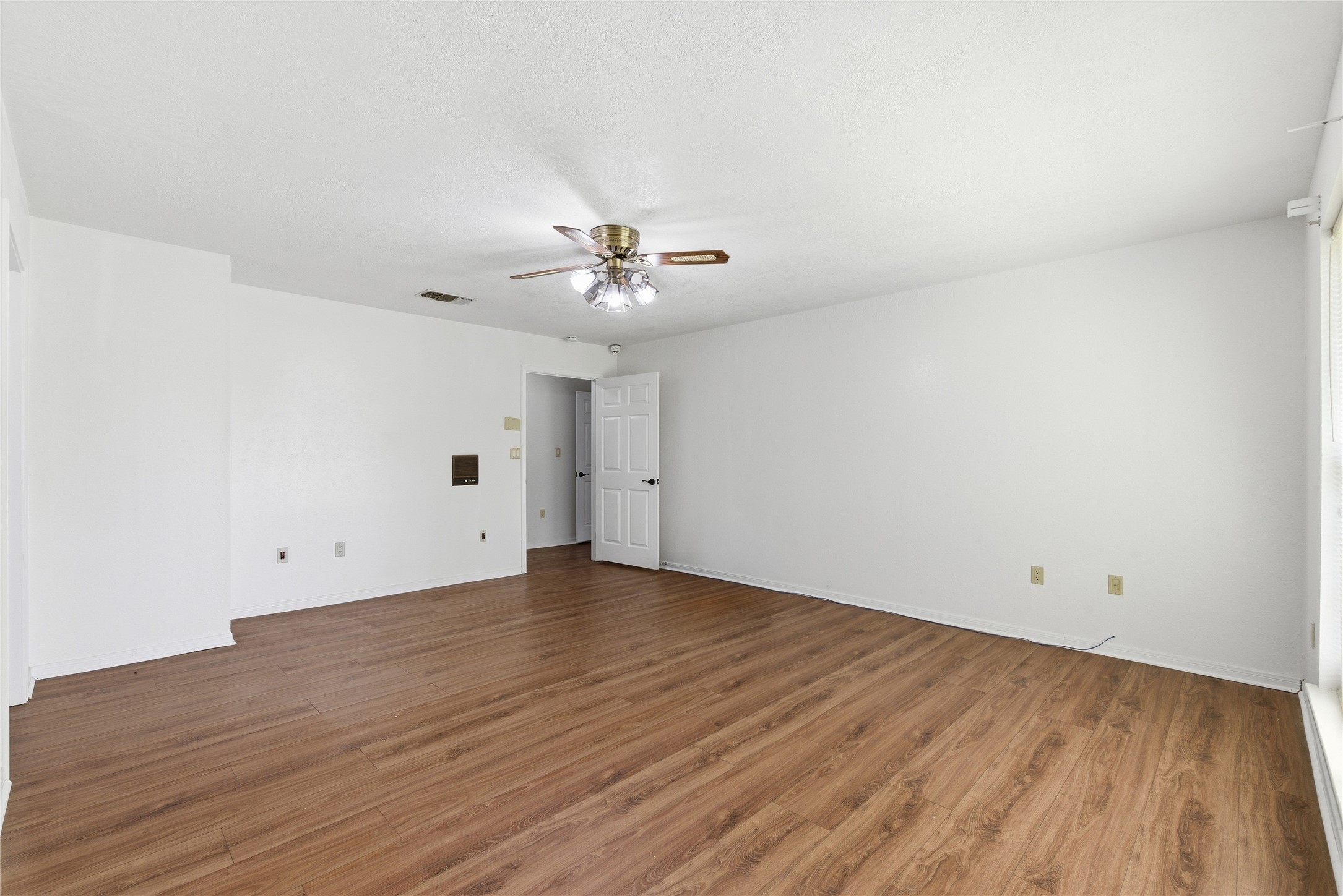 436 County Road 502A Sweeny, TX 77480 - Photo 24 of 45 a view of an empty room with wooden floor