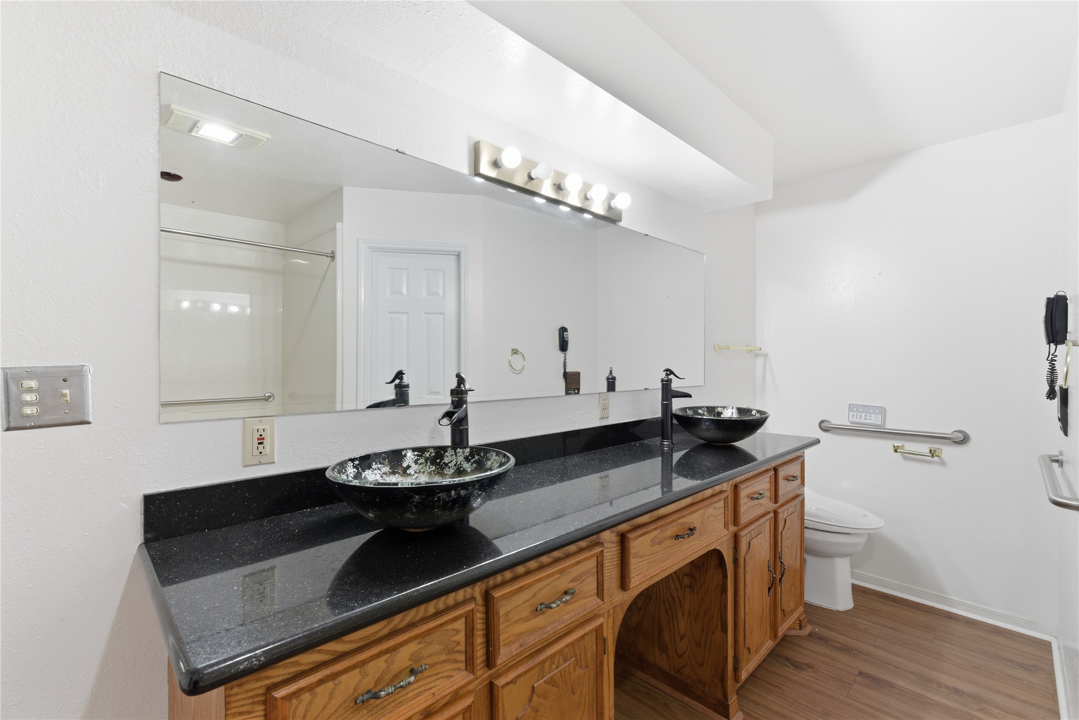 436 County Road 502A Sweeny, TX 77480 - Photo 26 of 45 a spacious bathroom with a granite countertop sink a toilet and a mirror