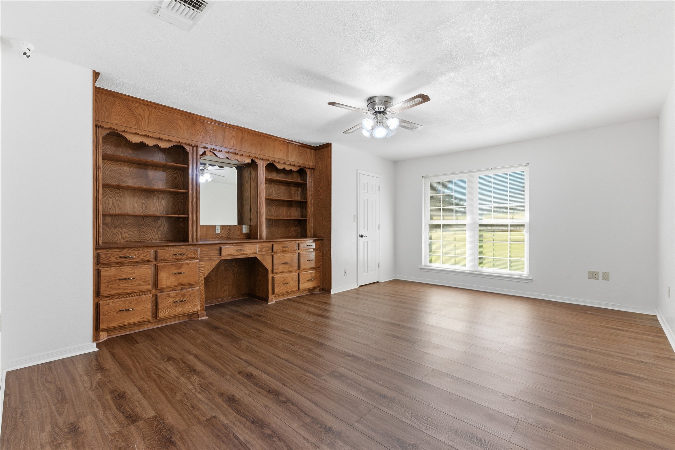 436 County Road 502A Sweeny, TX 77480 - Photo 30 of 45 a view of an empty room with window and wooden floor