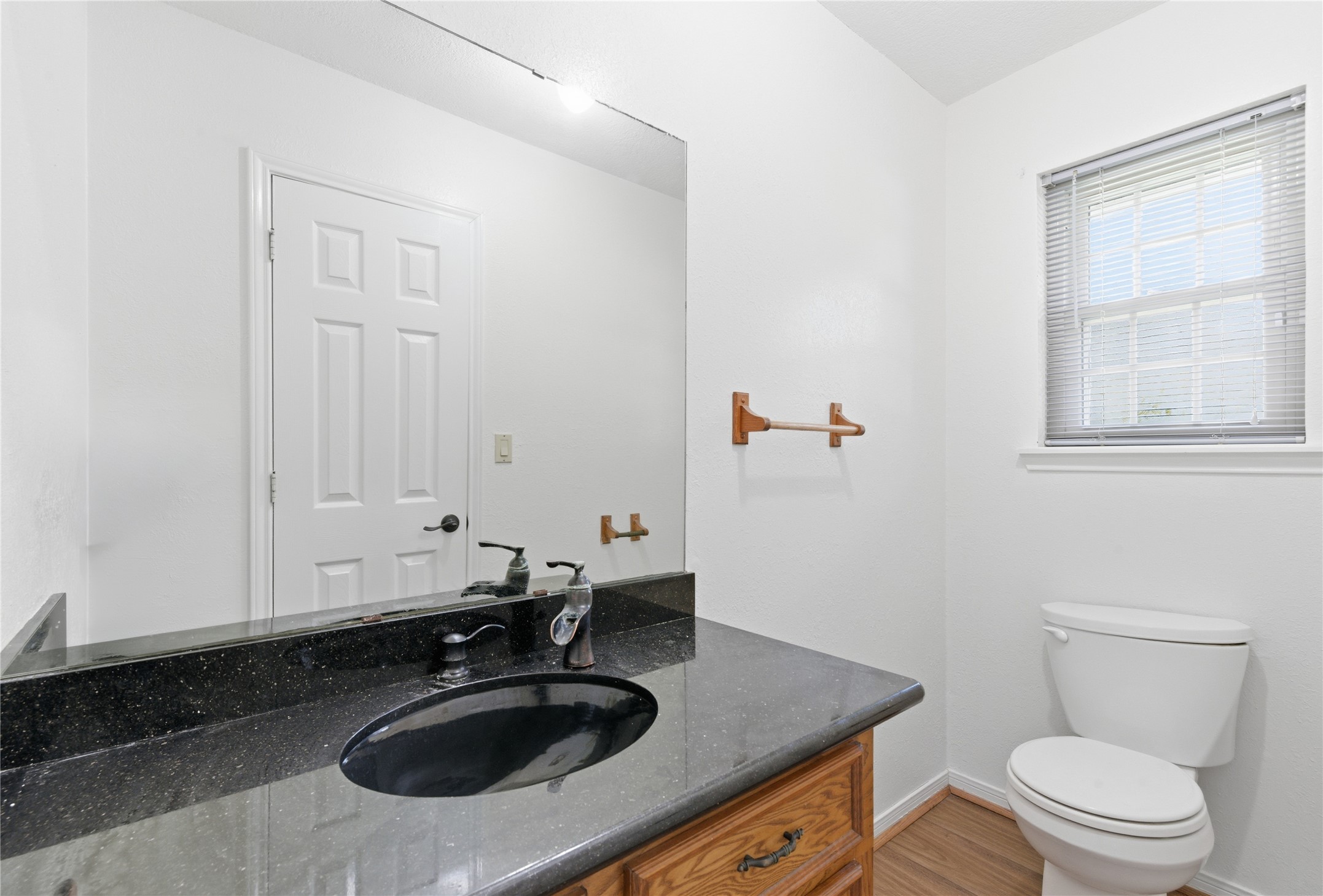 436 County Road 502A Sweeny, TX 77480 - Photo 37 of 45 a bathroom with a sink a toilet and a window