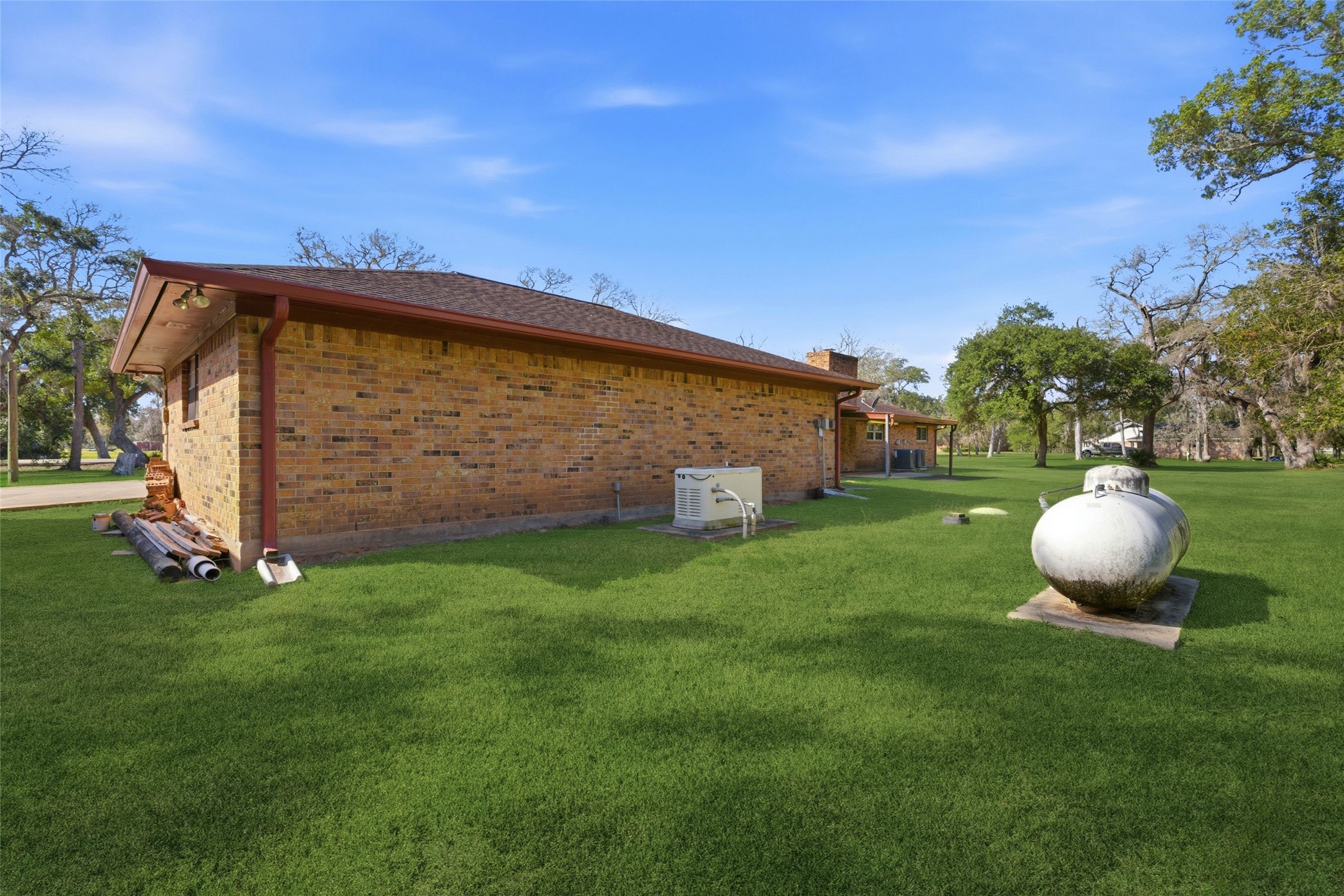 436 County Road 502A Sweeny, TX 77480 - Photo 45 of 45 a view of a backyard with a grill and wooden fence