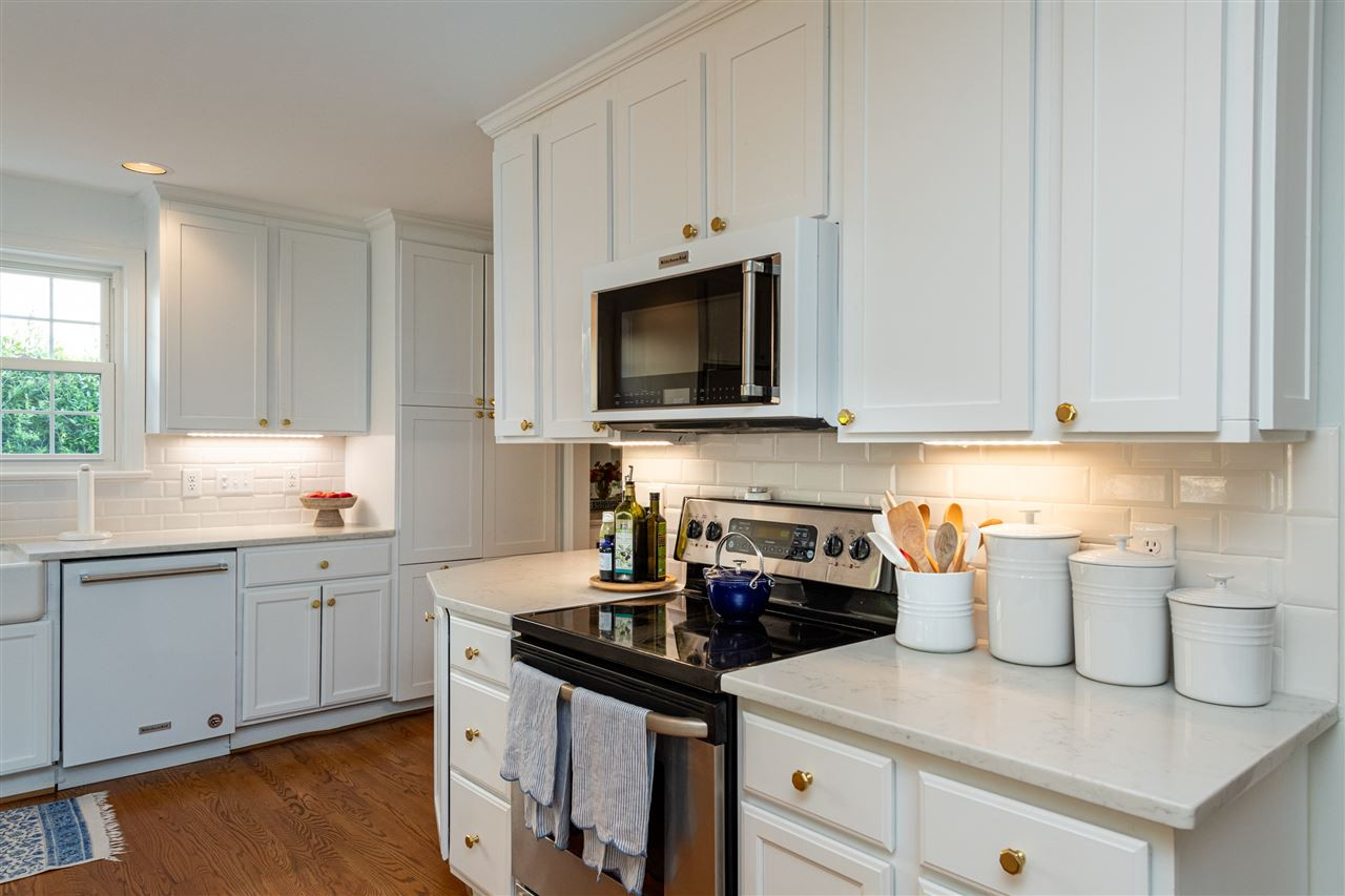 2705 Cooleemee Drive Raleigh, NC 27608 - Photo 12 of 30 The microwave and dishwasher were updated to blend in nicely with the cabinetry. Kitchen