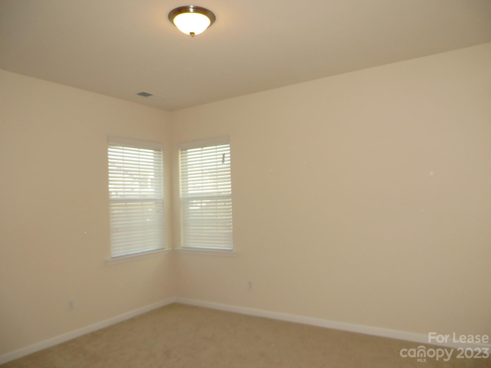 5107 Waterloo Drive Tega Cay, SC 29708 - Photo 13 of 25 a view of an empty room with a window