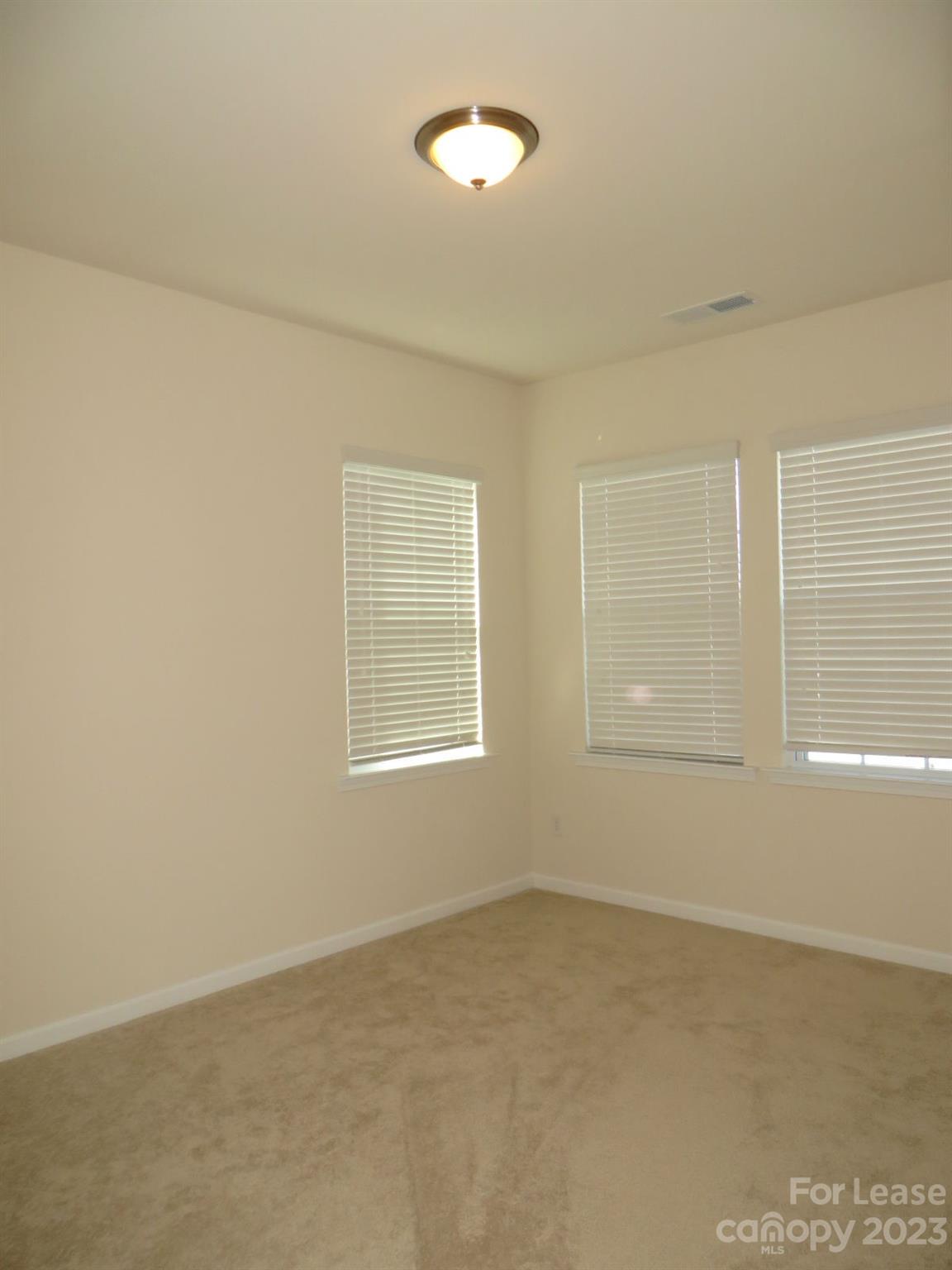 5107 Waterloo Drive Tega Cay, SC 29708 - Photo 15 of 25 an empty room with a window