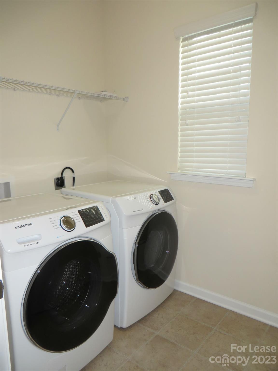 5107 Waterloo Drive Tega Cay, SC 29708 - Photo 21 of 25 a utility room with dryer and washer