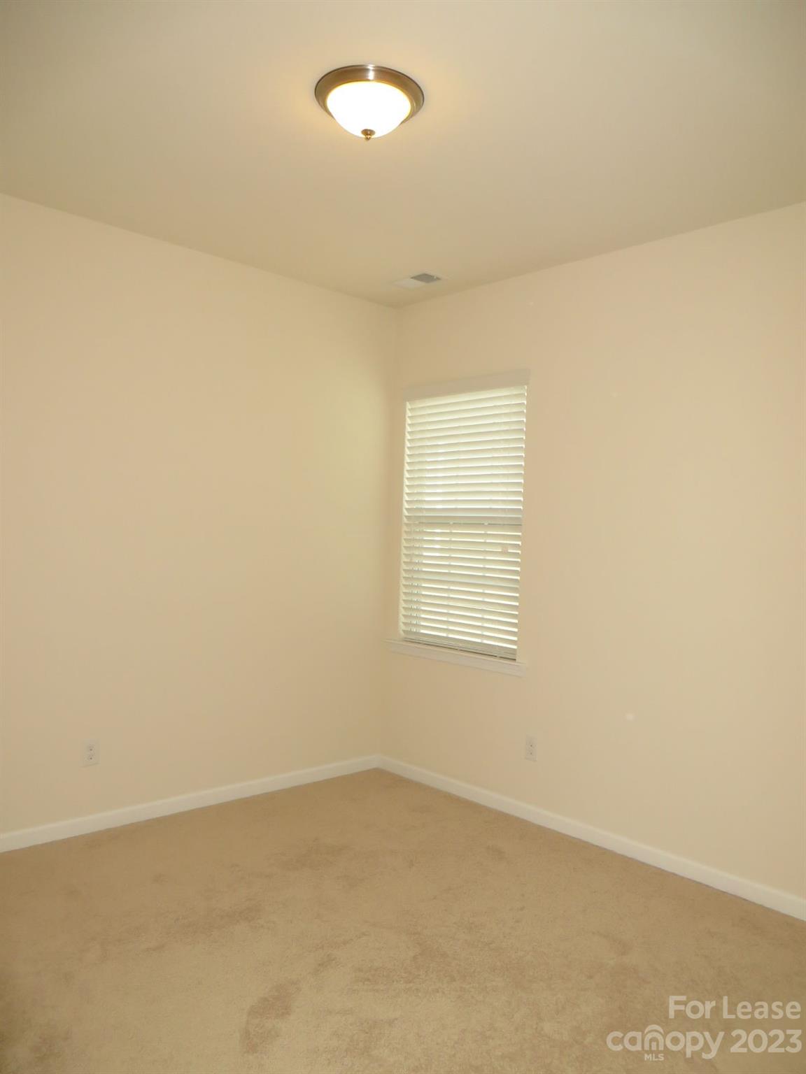 5107 Waterloo Drive Tega Cay, SC 29708 - Photo 10 of 25 an empty room with a window