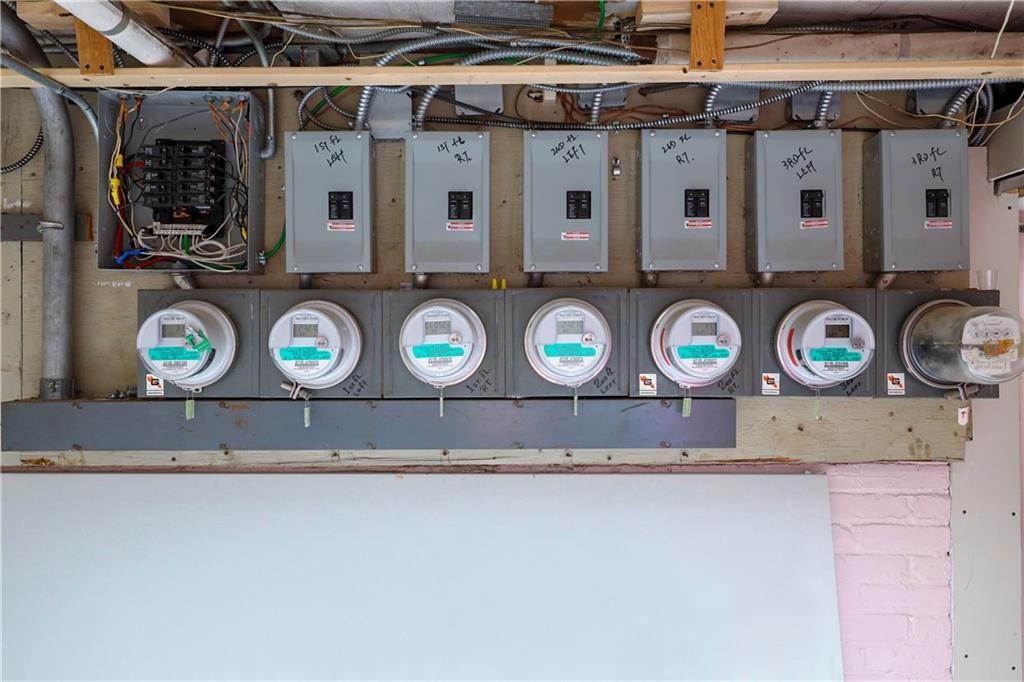 463 52nd Street Brooklyn, NY 11220 - Photo 21 of 22 a utility room with stainless steel appliances and chandelier