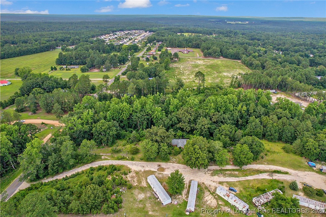 0 Mockingbird Hill Road Raeford, NC 28376 - Photo 11 of 14 an aerial view of green landscape with trees houses and lake view