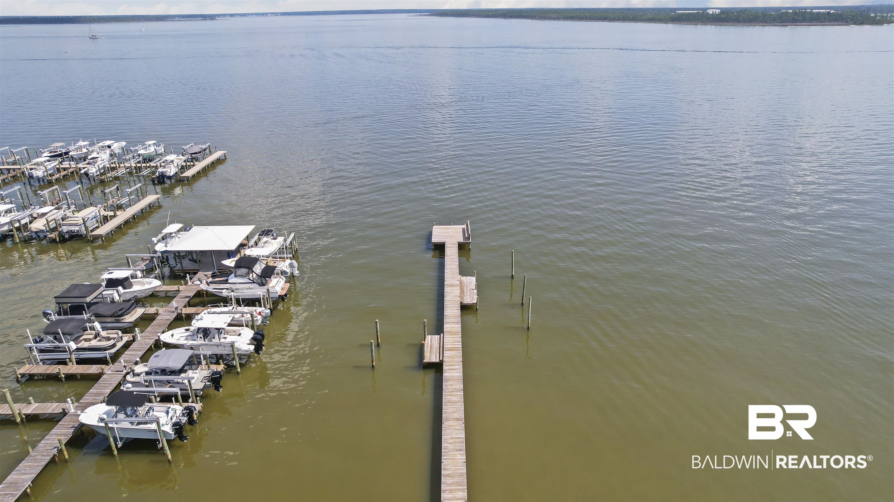 25925 Canal Road, Unit 207 Orange Beach, AL 36561 - Photo 6 of 42 Dock area featuring a water view