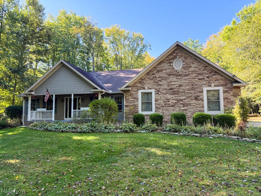 15990 Old State Road Middlefield, OH 44062 - Photo 1 of 24 Ranch-style house with a front yard and a porch