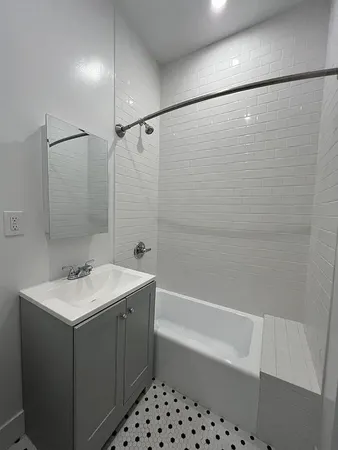 a kitchen with a refrigerator stove and microwave