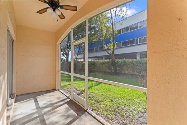 a view of a building with a yard