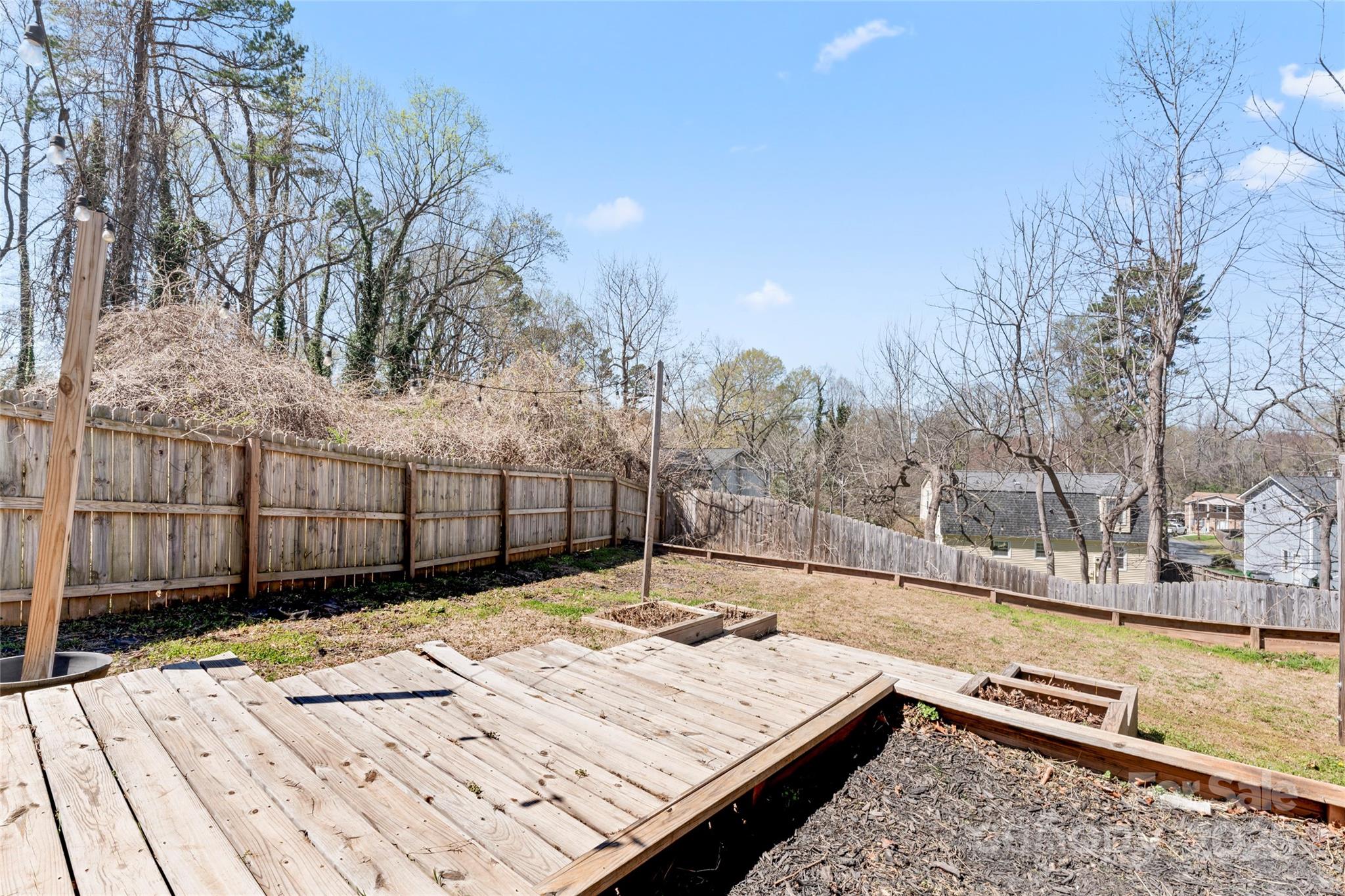 5501 Joyce Drive Charlotte, NC 28215 - Photo 26 of 35 a view of a backyard with wooden fence