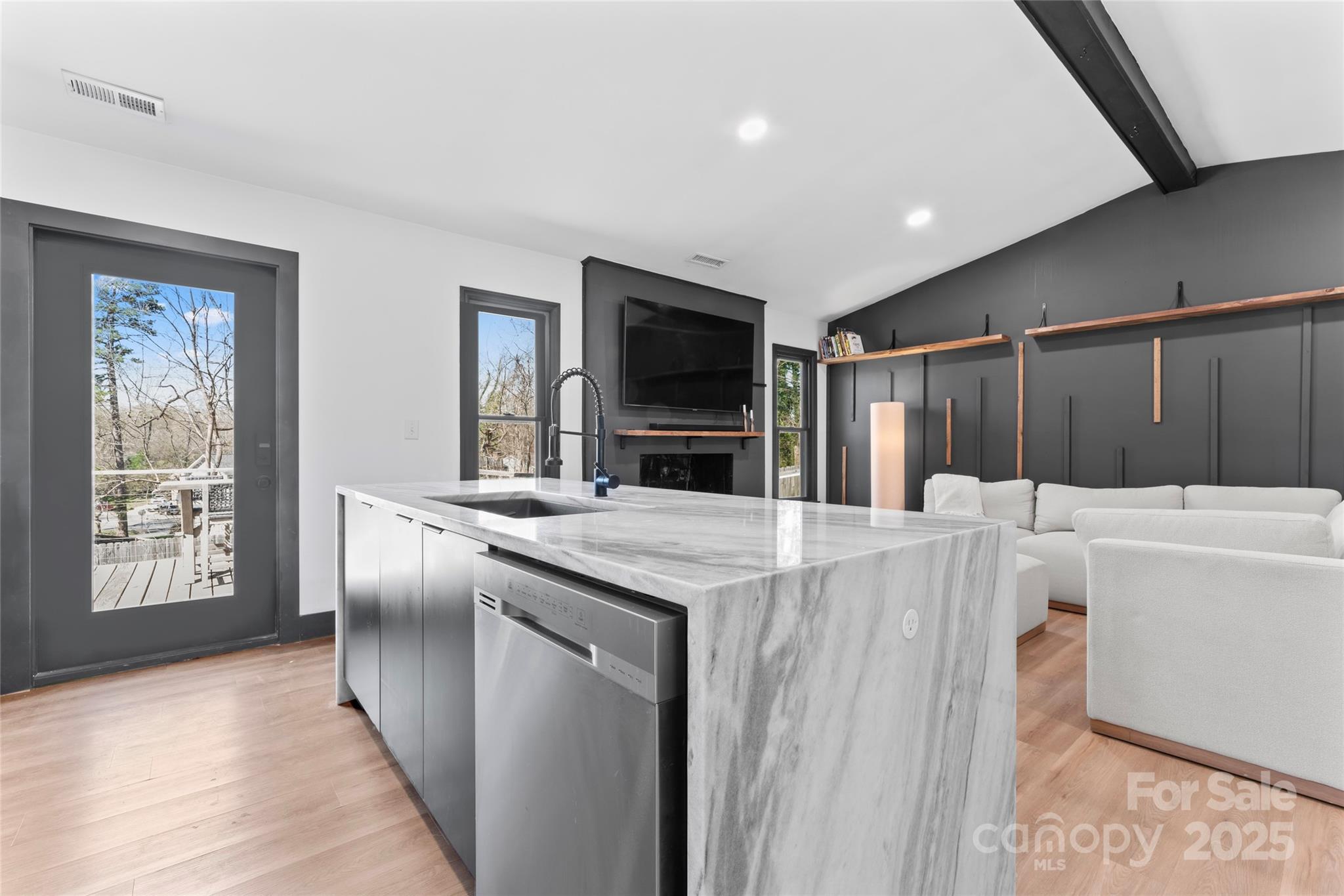 5501 Joyce Drive Charlotte, NC 28215 - Photo 4 of 35 a living room with a sink and a refrigerator