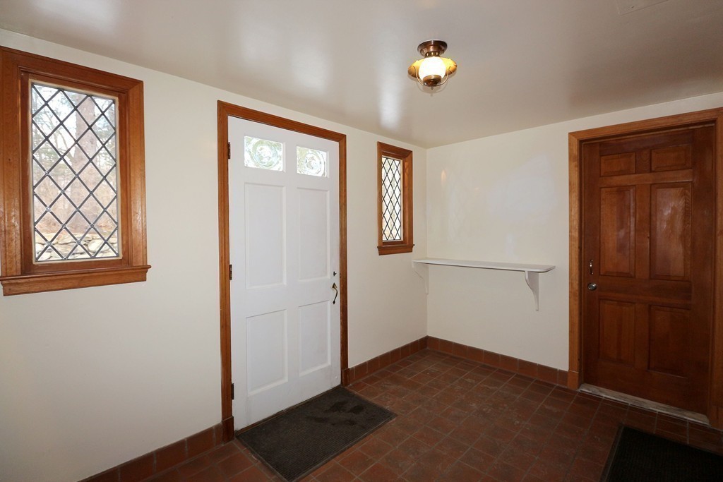 557 Dutton Road, Unit 3 Sudbury, MA 01776 - Photo 6 of 13 an empty room with windows and closet