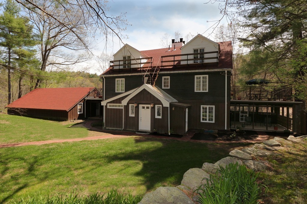 557 Dutton Road, Unit 3 Sudbury, MA 01776 - Photo 7 of 13 a front view of house with yard and green space