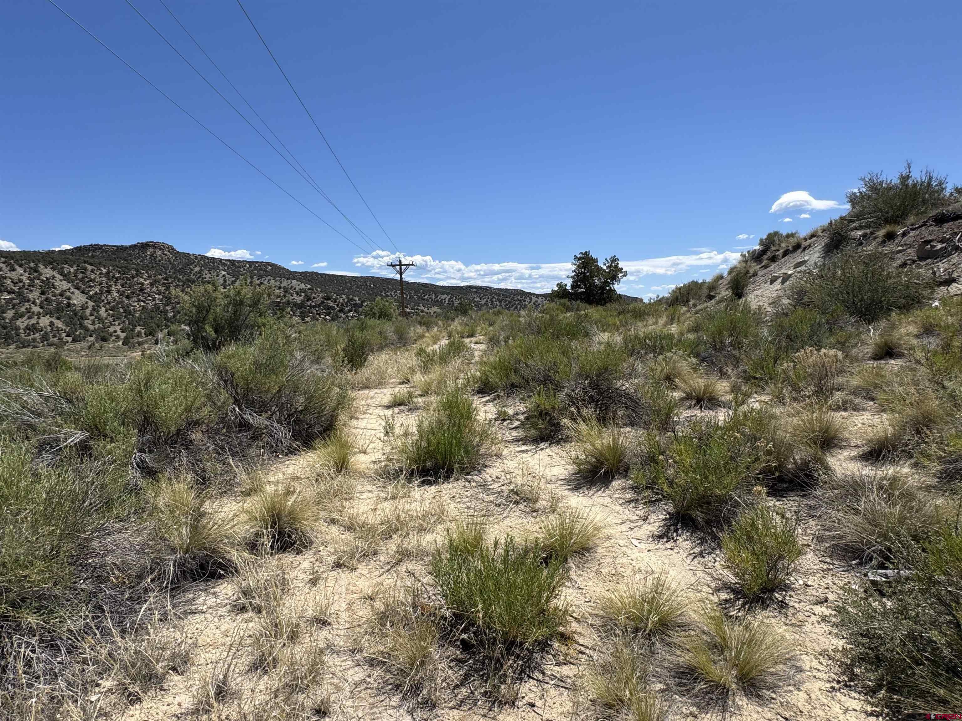 Tbd Rd G Cortez, CO 81321 - Photo 3 of 9 a view of a lake with a mountain in the background