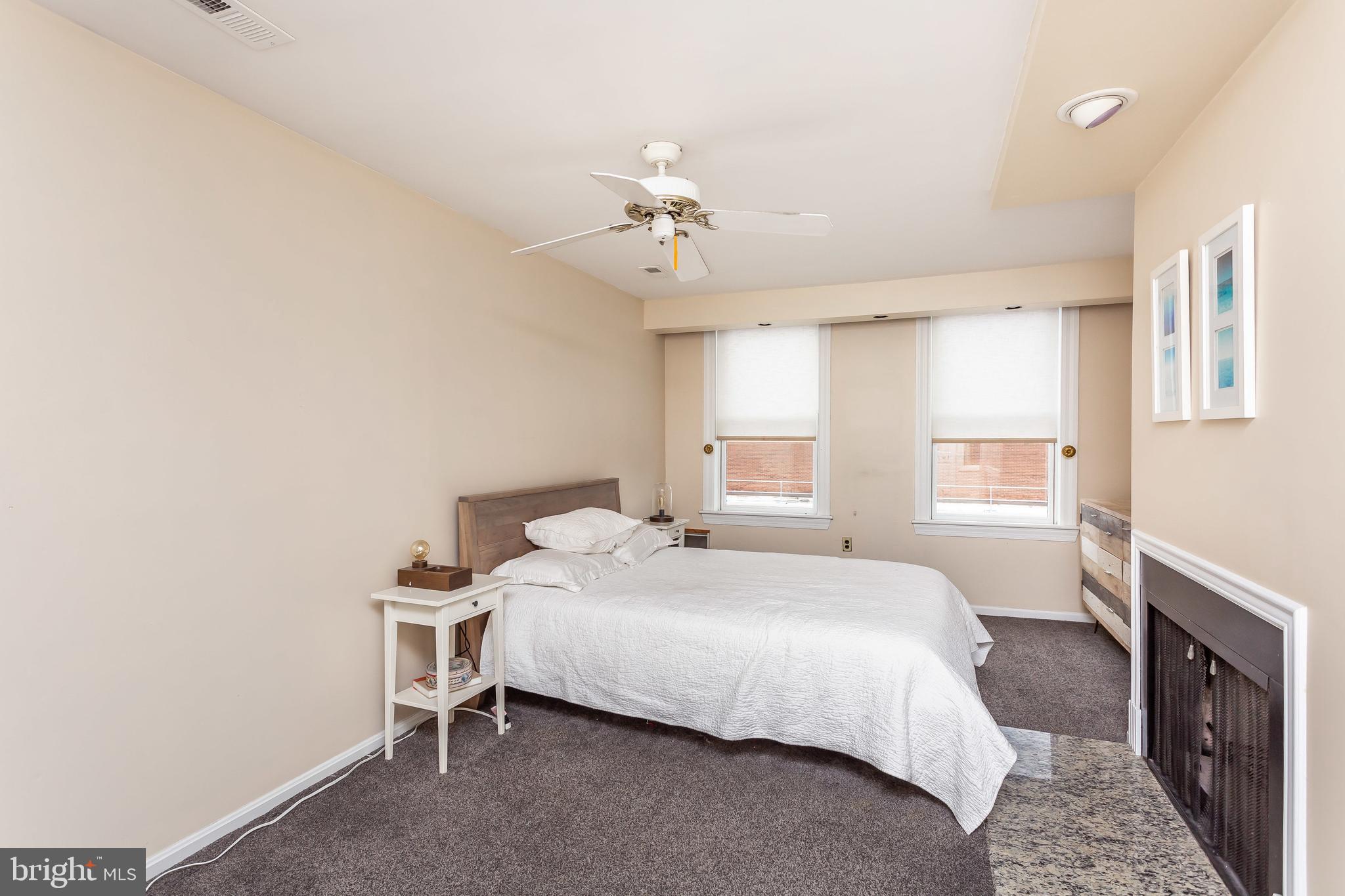 521 South Sharp Street Baltimore, MD 21201 - Photo 11 of 24 Master bedroom with fireplace