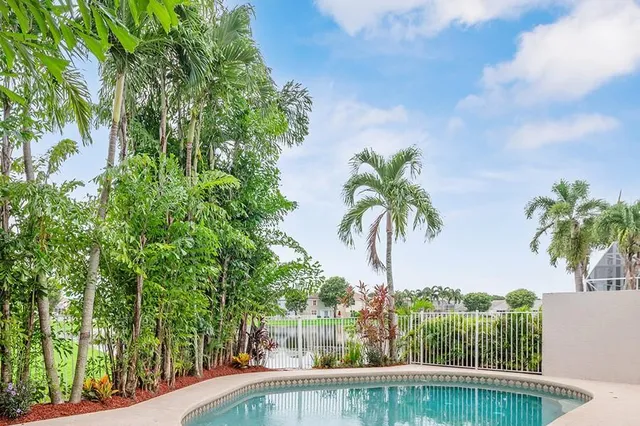 a view of swimming pool from a balcony