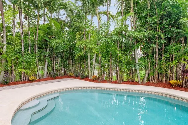 a backyard of a house with lots of green space