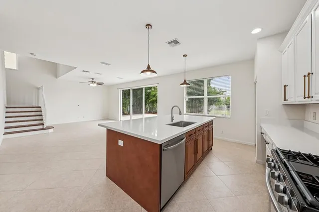 a kitchen with a stove and a sink