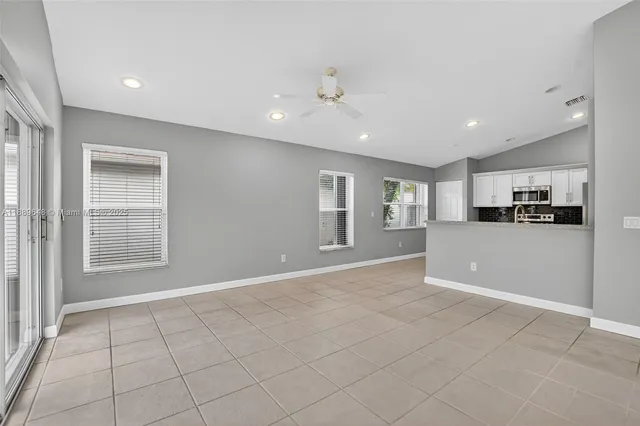 a view of an empty room with a window
