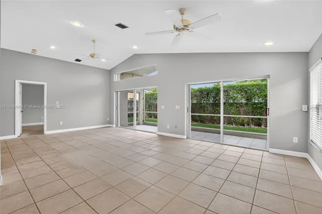 a kitchen with stainless steel appliances granite countertop a refrigerator sink and stove