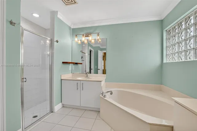 an empty room with a ceiling fan and a window