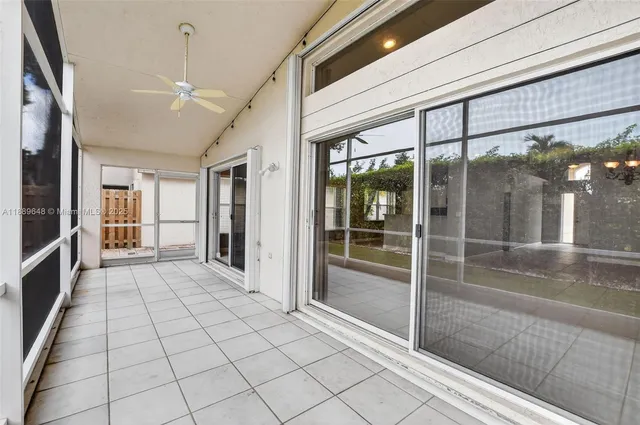an aerial view of residential houses with outdoor space and parking