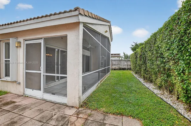 an aerial view of a house with a garden