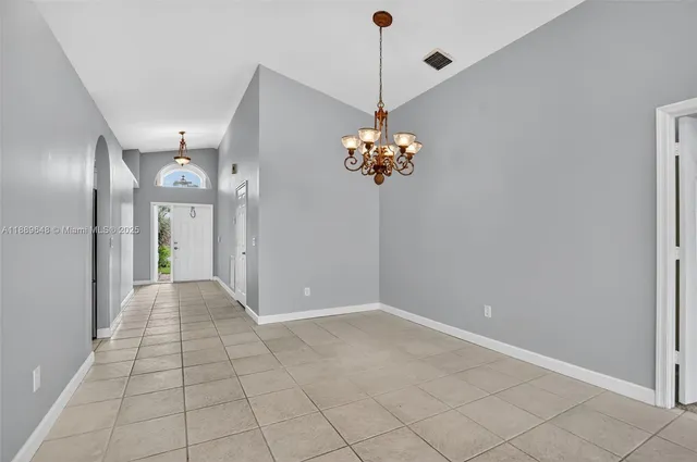 a view of a hallway with closet and entryway