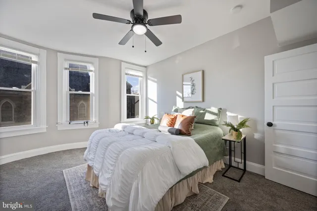 a bedroom with bed and window