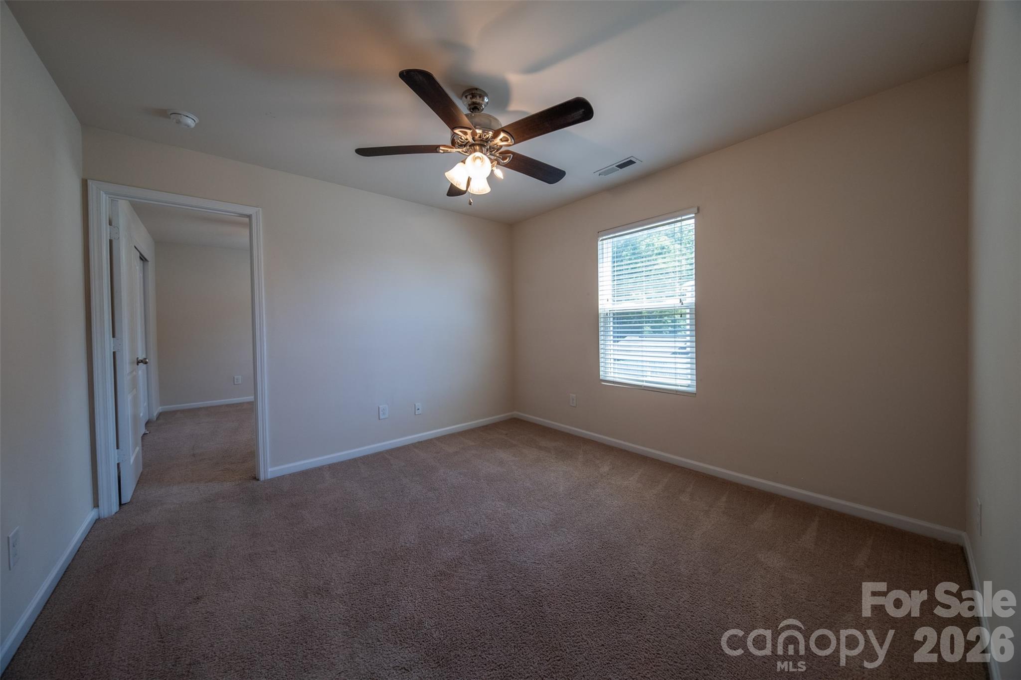 3006 Houndscroft Road Indian Trail, NC 28079 - Photo 29 of 39 an empty room with windows and fan