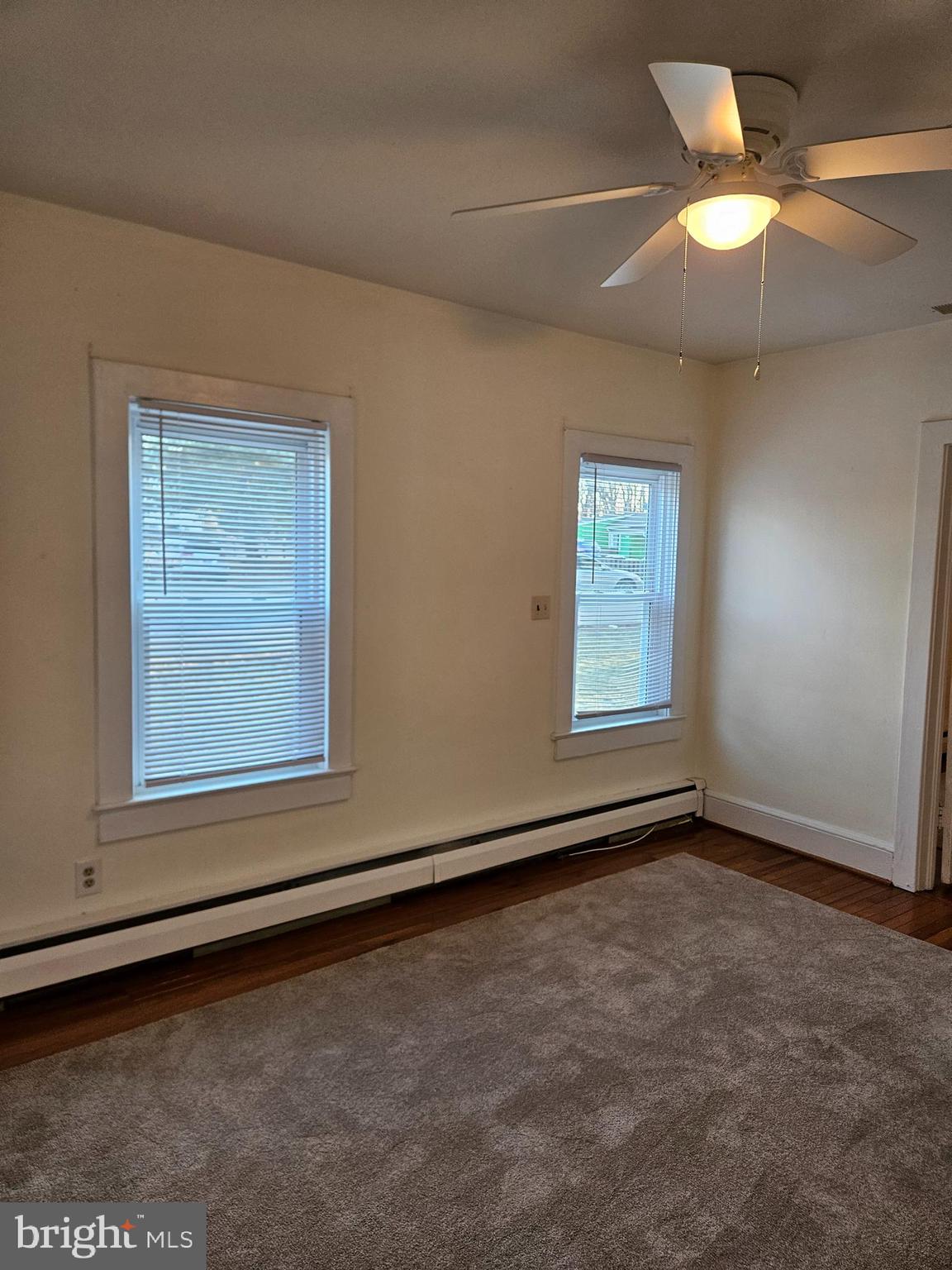 7204 Webster Lane Fort Washington, MD 20744 - Photo 11 of 27 an empty room with windows and fan