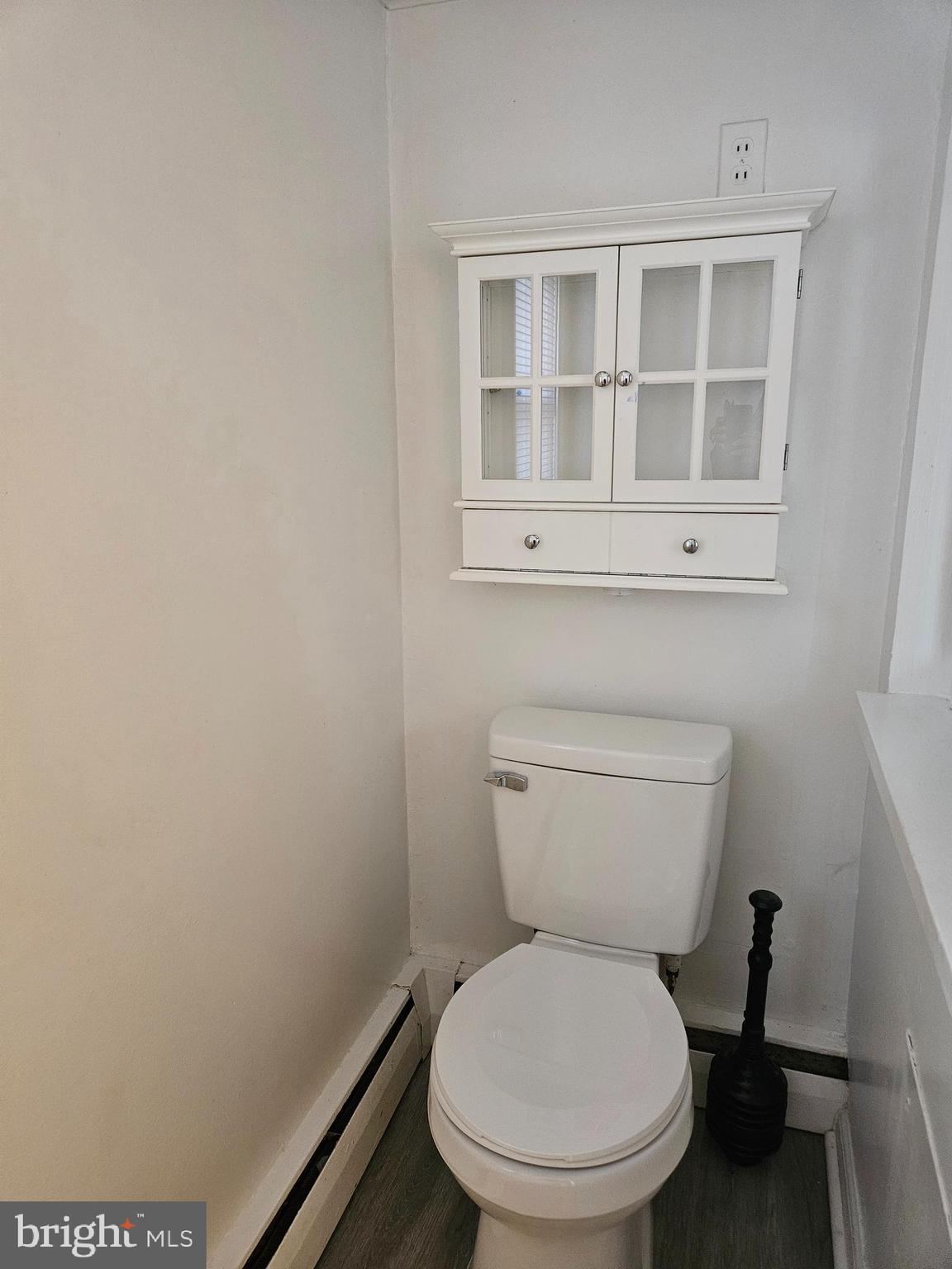 7204 Webster Lane Fort Washington, MD 20744 - Photo 14 of 27 a white toilet sitting next to a window