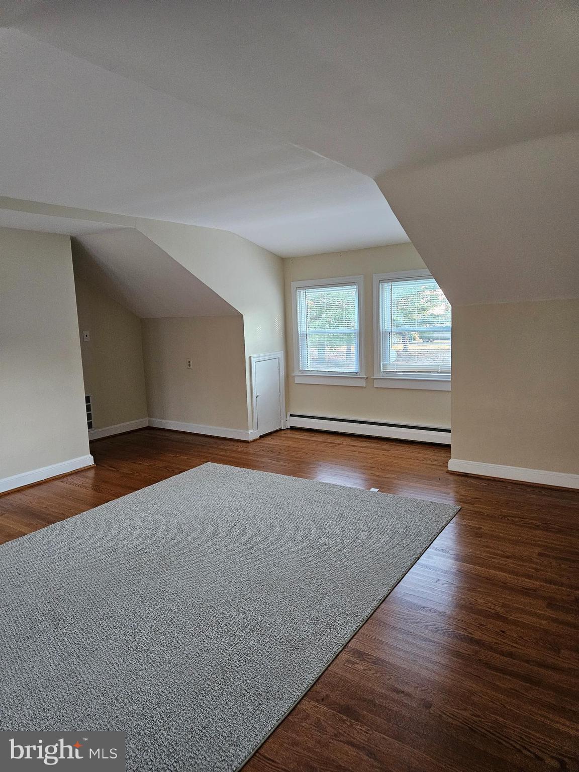 7204 Webster Lane Fort Washington, MD 20744 - Photo 16 of 27 an empty room with wooden floor and windows
