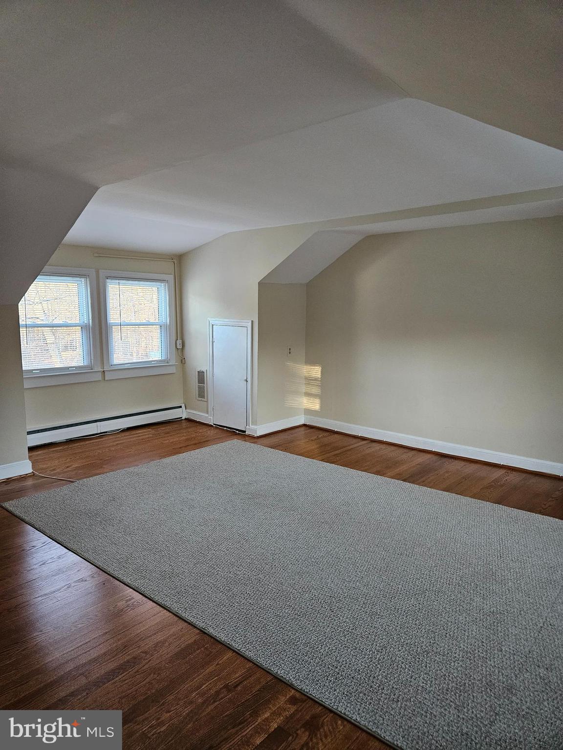 7204 Webster Lane Fort Washington, MD 20744 - Photo 17 of 27 an empty room with wooden floor and windows